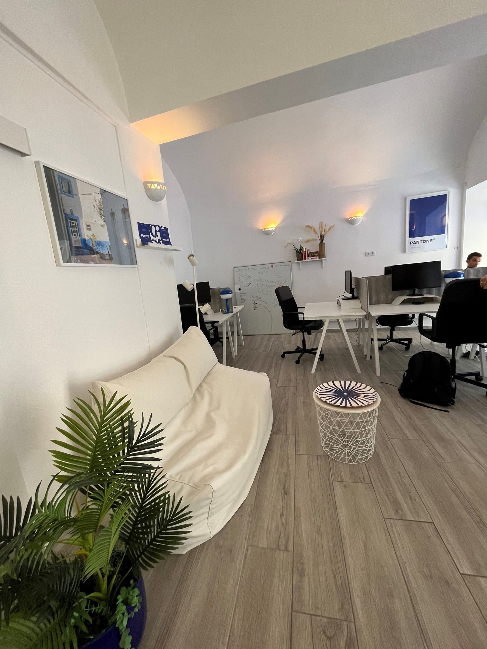 View of POMAR coworking sofa with desks in the background